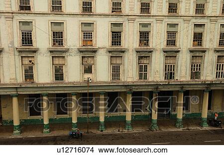 View of the facade of a dilapidated commercial building, Havana, Cuba View Large Photo Image Picture - View of the facade of a dilapidated commercial building, Havana, Cuba. Fotosearch