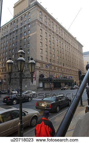 Stock Image - Man walking on the sidewalk in Montreal, Canada. Fotosearch