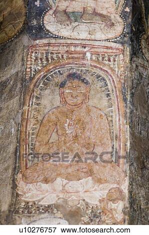 Stock Photo - Fresco of Buddha on the wall of a cave, Ajanta, Maharashtra, India. Fotosearch