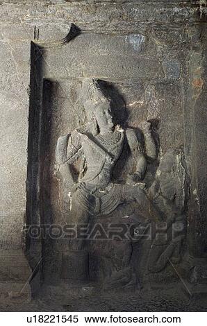 Statue of a Hindu god carved in a cave, Ellora, Aurangabad, Maharashtra, India View Large Photo Image Stock Photography - Statue of a Hindu god carved in a cave, Ellora, Aurangabad, Maharashtra, India. Fotosearch
