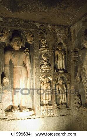 Stock Image - Statue of Buddha in a cave, Ajanta, Maharashtra, India. Fotosearch