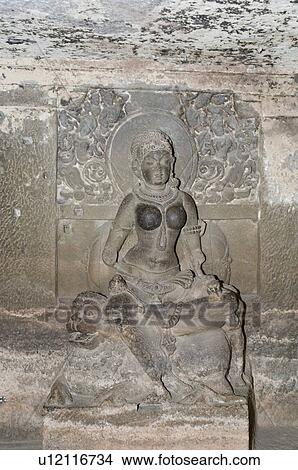 Statue of Jain goddess carved in a cave, Ellora, Aurangabad, Maharashtra, India View Large Photo Image Picture - Statue of Jain goddess carved in a cave, Ellora, Aurangabad, Maharashtra, India. Fotosearch