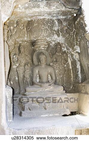 Statue of Mahavira carved in a cave, Ellora, Aurangabad, Maharashtra, India View Large Photo Image Stock Photography - Statue of Mahavira carved in a cave, Ellora, Aurangabad, Maharashtra, India. Fotosearch