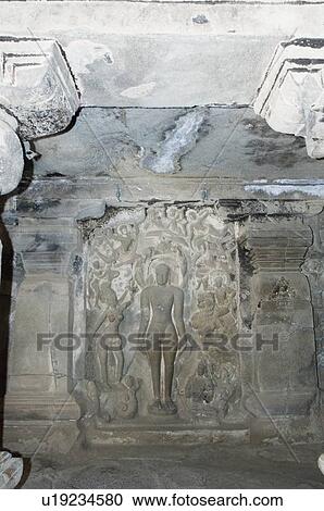 Stock Image - Statues carved in a cave, Ellora, Aurangabad, Maharashtra, India. Fotosearch