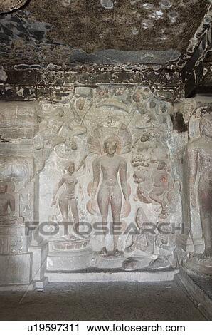 Stock Image - Statues in a cave, Ellora, Aurangabad, Maharashtra, India. Fotosearch