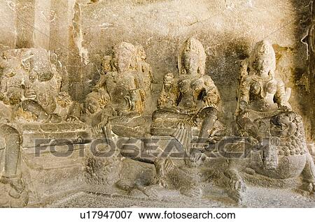 Stock Photo - Statues of Hindu gods carved in a cave, Ellora, Aurangabad, Maharashtra, India. Fotosearch