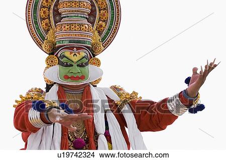 Picture - Close-up of a Kathakali dance performer dancing. Fotosearch