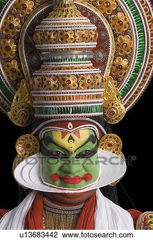 Stock Image - Close-up of a Kathakali dance performer. Fotosearch