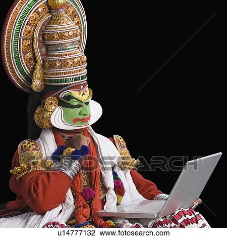 Close-up of a Kathakali dance performer using a laptop View Large Photo Image Stock Image - Close-up of a Kathakali dance performer using a laptop. Fotosearch
