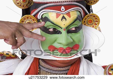 Stock Photo - Close-up of a Kathakali dance performer gesturing. Fotosearch
