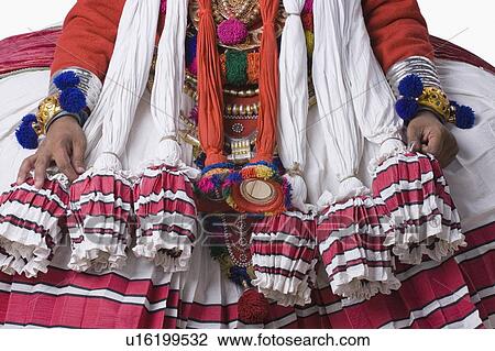 Mid section view of a Kathakali dance performer View Large Photo Image Stock Image - Mid section view of a Kathakali dance performer. Fotosearch