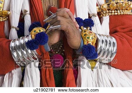 Stock Image - Mid section view of a Kathakali dance performer. Fotosearch