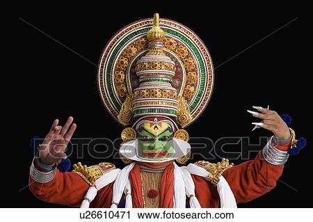 Stock Image - Portrait of a Kathakali dance performer dancing. Fotosearch