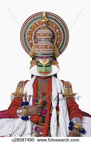 Stock Image - Portrait of a Kathakali dance performer sitting. Fotosearch