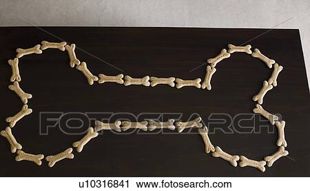 Close-up of a dog bone made with dog biscuits on a blackboard View Large Photo Image Stock Image - Close-up of a dog bone made with dog biscuits on a blackboard. Fotosearch