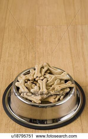 Close-up of dog biscuits in a dog bowl View Large Photo Image Stock Image - Close-up of dog biscuits in a dog bowl. Fotosearch