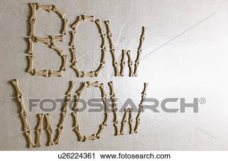 Close-up of texts BOW WOW made with dog biscuits on a white surface View Large Photo Image Stock Image - Close-up of texts BOW WOW made with dog biscuits on a white surface. Fotosearch