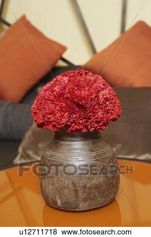 Stock Photo - Close-up of a bunch of flowers in a metal vase. Fotosearch