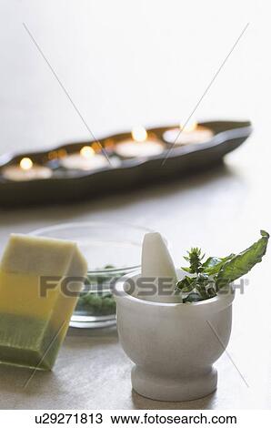 Close-up of an aromatherapy candle burning with herbs in a mortar View Large Photo Image Stock Image - Close-up of an aromatherapy candle burning with herbs in a mortar. Fotosearch