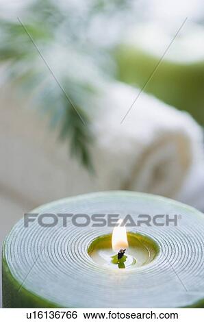 Stock Photograph - Close-up of an aromatherapy candle burning. Fotosearch