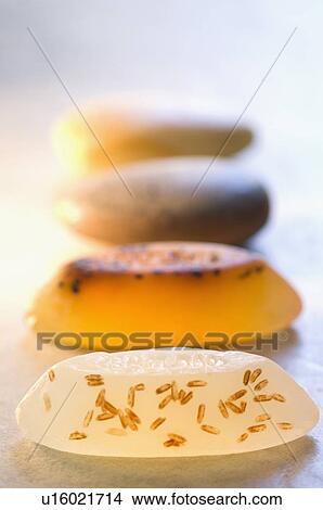 Picture - Close-up of four soaps in a row. Fotosearch