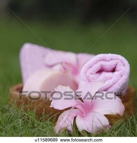 Stock Photo - Close-up of spa treatment products on the grass. Fotosearch