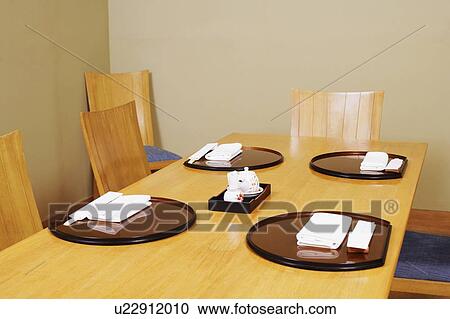 Stock Image - High angle view of a place setting in a restaurant. Fotosearch