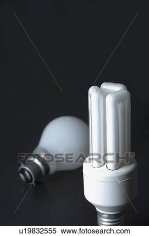 Close-up of a light bulb with a fluorescent light bulb View Large Photo Image Stock Photography - Close-up of a light bulb with a fluorescent light bulb. Fotosearch