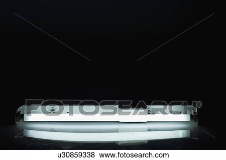 Stock Photo - Close-up of a lit fluorescent light. Fotosearch