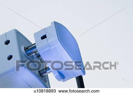 Close-up of a three pin plug with an electric socket View Large Photo Image Stock Image - Close-up of a three pin plug with an electric socket. Fotosearch