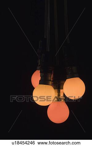 Close-up of four light bulbs View Large Photo Image Stock Photograph - Close-up of four light bulbs. Fotosearch