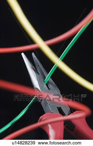 Stock Photo - Close-up of pliers with wires. Fotosearch