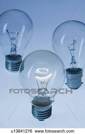 Stock Photograph - Close-up of three light bulbs. Fotosearch