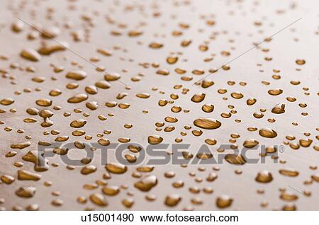Close-up of water drops on a brown surface View Large Photo Image Stock Image - Close-up of water drops on a brown surface. Fotosearch
