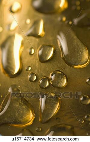 Close-up of water drops on a metal surface View Large Photo Image Picture - Close-up of water drops on a metal surface. Fotosearch