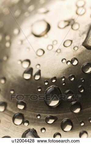 Close-up of water drops on a metal surface View Large Photo Image Stock Photo - Close-up of water drops on a metal surface. Fotosearch