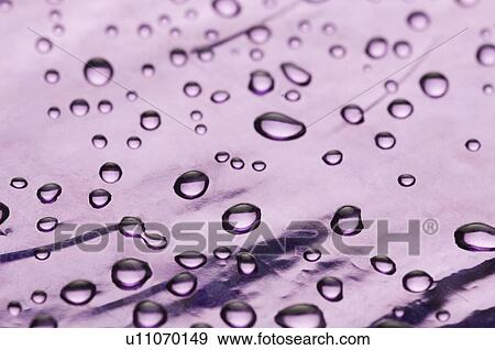 Close-up of water drops on a pink surface View Large Photo Image Stock Photo - Close-up of water drops on a pink surface. Fotosearch
