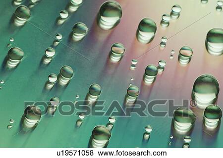 Close-up of water drops on a multi-colored surface View Large Photo Image Stock Photo - Close-up of water drops on a multi-colored surface. Fotosearch