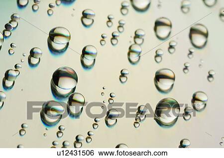 Close-up of water drops on a surface View Large Photo Image Stock Photograph - Close-up of water drops on a surface. Fotosearch