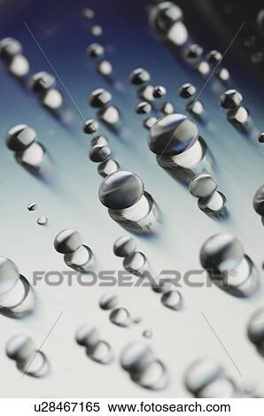 Close-up of water drops on a surface View Large Photo Image Stock Photography - Close-up of water drops on a surface. Fotosearch