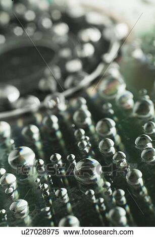 Close-up of water drops View Large Photo Image Stock Photography - Close-up of water drops. Fotosearch