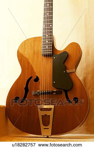 Close-up of a guitar View Large Photo Image Stock Photo - Close-up of a guitar. Fotosearch