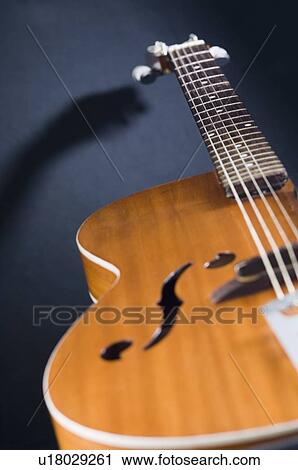Close-up of an acoustic guitar View Large Photo Image Stock Image - Close-up of an acoustic guitar. Fotosearch