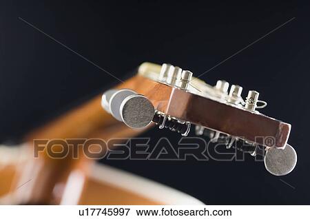 Close-up of an acoustic guitar View Large Photo Image Stock Photo - Close-up of an acoustic guitar. Fotosearch