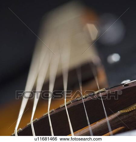 Stock Photograph - Close-up of strings of a guitar. Fotosearch