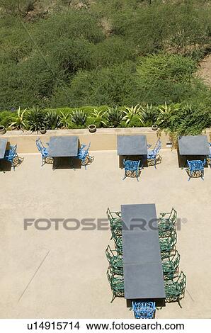 Picture - High angle view of chairs and tables on the roof of a restaurant. Fotosearch