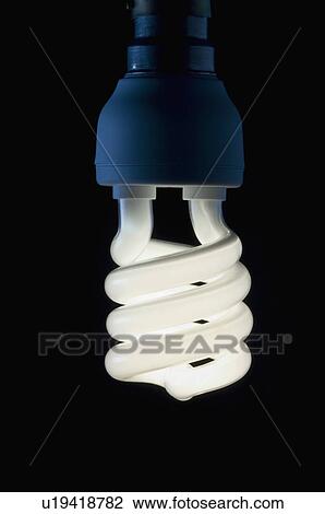 Stock Image - Close-up of a lit compact fluorescent light bulb. Fotosearch