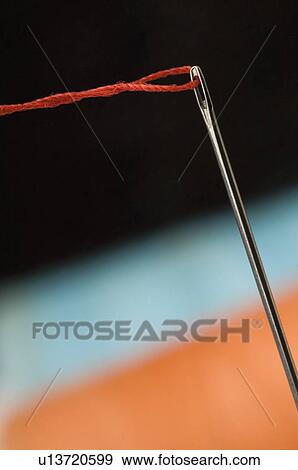 Stock Photo - Close-up of a needle and a thread. Fotosearch