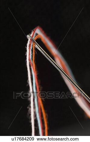Stock Photo - Close-up of a needle and threads. Fotosearch