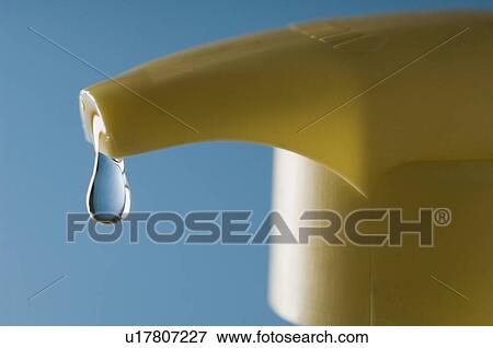 Close-up of a water drop falling from a soap dispenser View Large Photo Image Stock Photo - Close-up of a water drop falling from a soap dispenser. Fotosearch